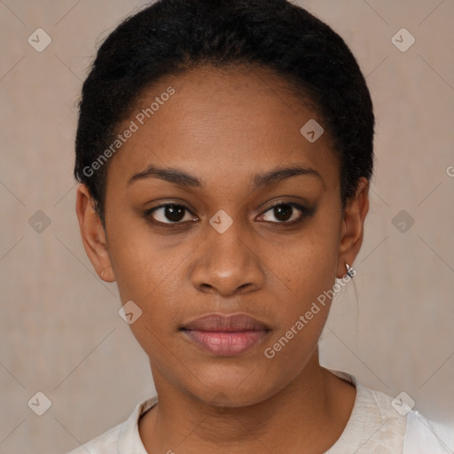 Joyful black young-adult female with short  black hair and brown eyes