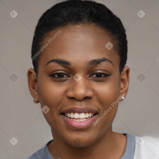 Joyful black young-adult female with short  black hair and brown eyes