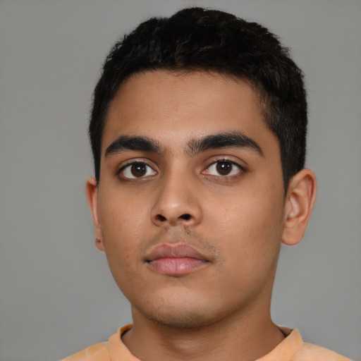 Neutral latino young-adult male with short  black hair and brown eyes