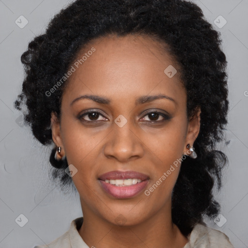 Joyful black adult female with long  black hair and brown eyes