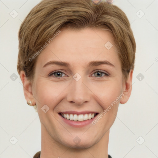 Joyful white young-adult female with short  brown hair and grey eyes