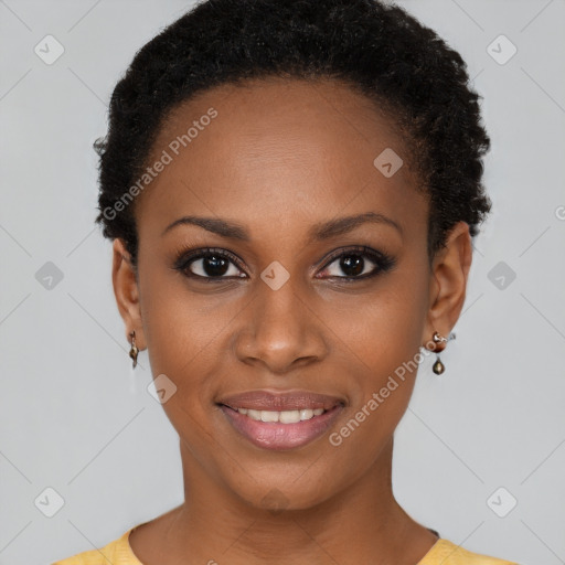 Joyful black young-adult female with short  brown hair and brown eyes