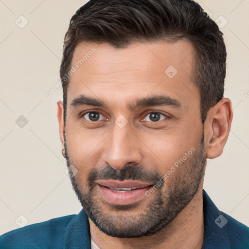 Joyful white young-adult male with short  brown hair and brown eyes