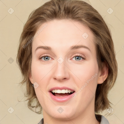 Joyful white young-adult female with medium  brown hair and green eyes