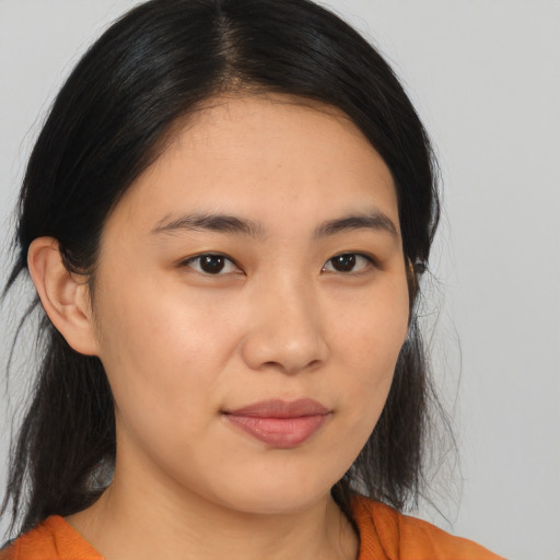Joyful asian young-adult female with medium  brown hair and brown eyes