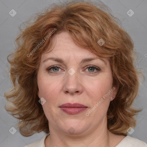 Joyful white adult female with medium  brown hair and blue eyes