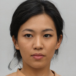 Neutral asian young-adult female with medium  black hair and brown eyes