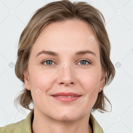 Joyful white young-adult female with medium  brown hair and blue eyes