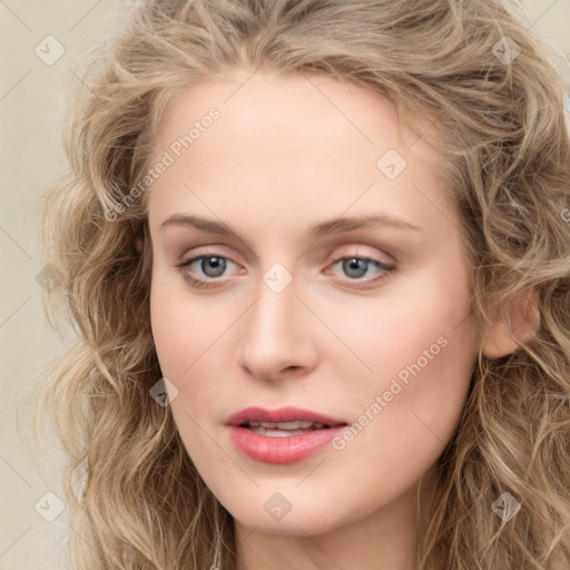 Joyful white young-adult female with long  brown hair and blue eyes