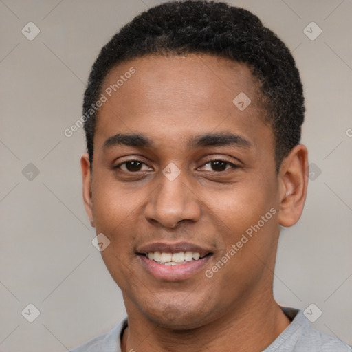 Joyful black young-adult male with short  black hair and brown eyes