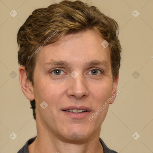 Joyful white adult male with short  brown hair and grey eyes