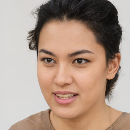 Joyful asian young-adult female with short  brown hair and brown eyes