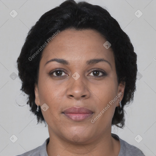 Joyful latino adult female with short  black hair and brown eyes