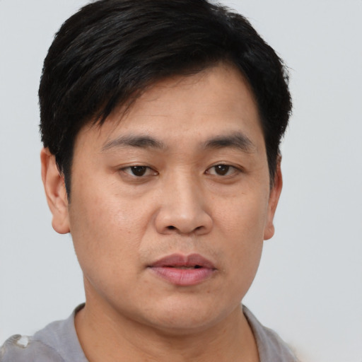 Neutral asian young-adult male with short  black hair and brown eyes