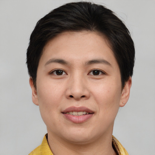 Joyful white young-adult female with short  brown hair and brown eyes