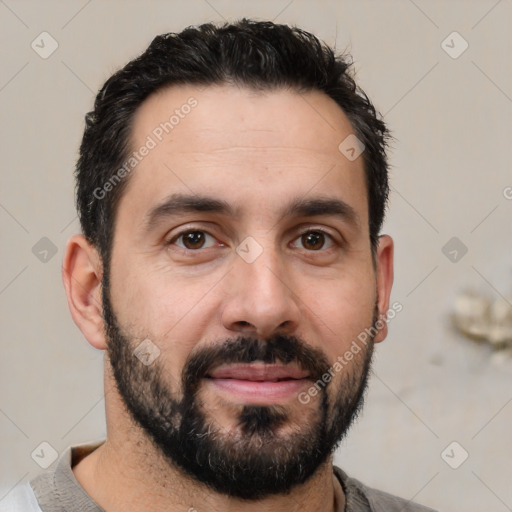 Joyful white young-adult male with short  black hair and brown eyes