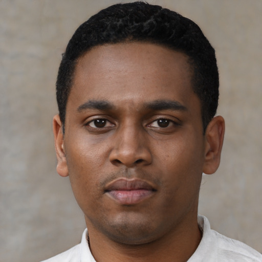 Neutral black young-adult male with short  black hair and brown eyes