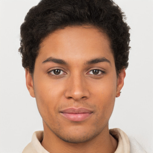 Joyful latino young-adult male with short  brown hair and brown eyes