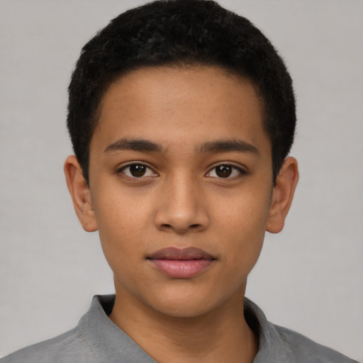 Joyful latino child male with short  brown hair and brown eyes