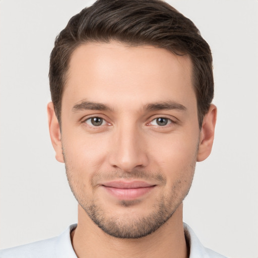 Joyful white young-adult male with short  brown hair and brown eyes