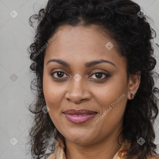 Joyful black young-adult female with long  brown hair and brown eyes