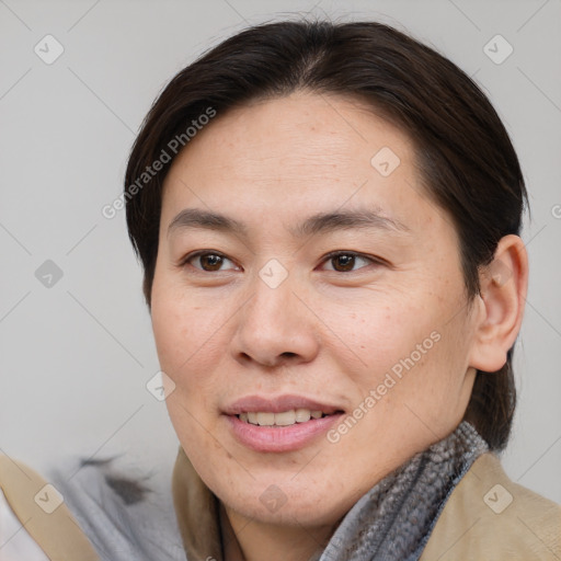 Joyful white adult female with medium  brown hair and brown eyes