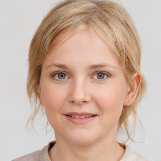 Joyful white young-adult female with medium  brown hair and blue eyes