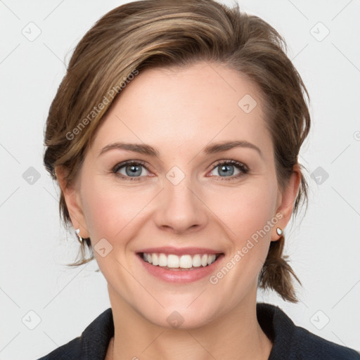 Joyful white young-adult female with medium  brown hair and blue eyes