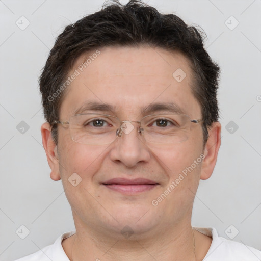 Joyful white adult male with short  brown hair and brown eyes