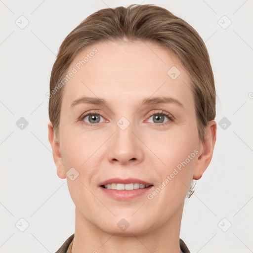 Joyful white young-adult female with short  brown hair and grey eyes