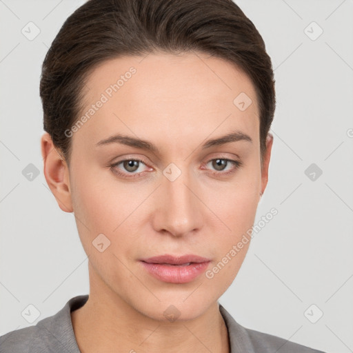 Neutral white young-adult female with short  brown hair and brown eyes