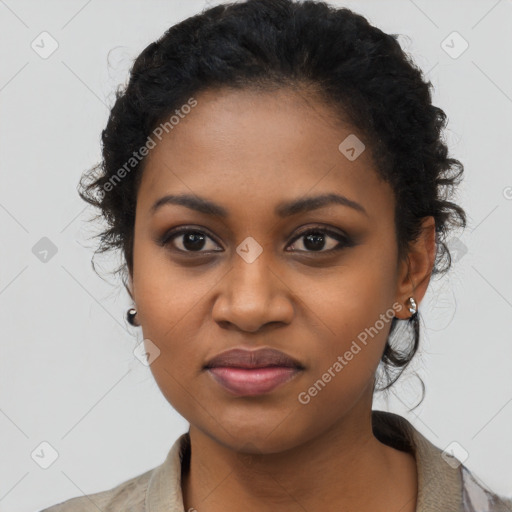 Joyful black young-adult female with long  black hair and brown eyes