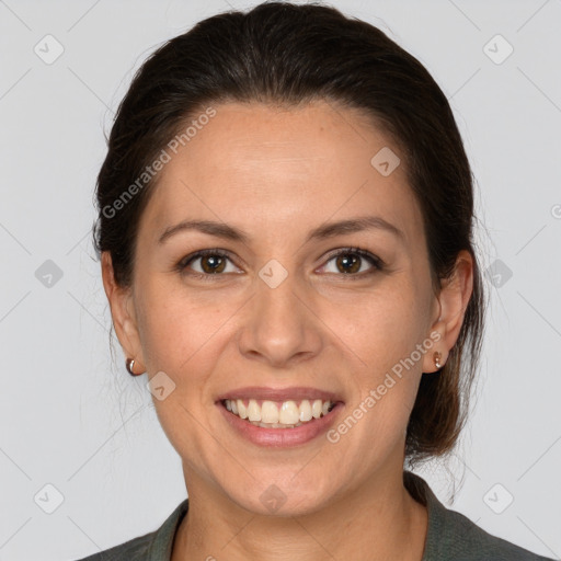 Joyful white adult female with medium  brown hair and brown eyes