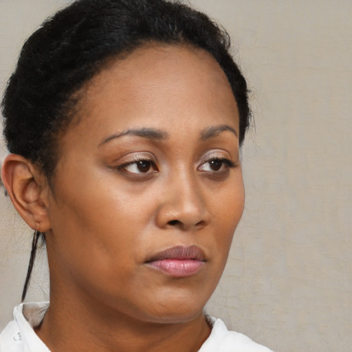 Neutral black young-adult female with short  brown hair and brown eyes