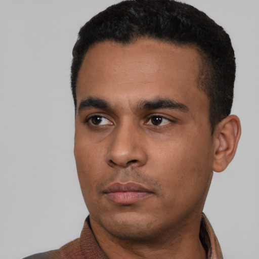 Neutral latino young-adult male with short  black hair and brown eyes