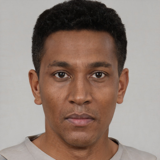 Neutral black young-adult male with short  black hair and brown eyes