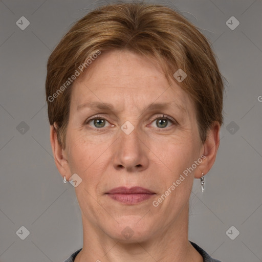 Joyful white adult female with short  brown hair and grey eyes