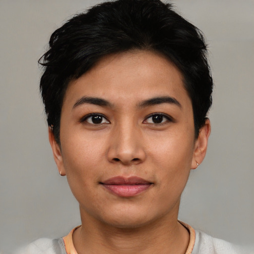 Joyful asian young-adult female with short  black hair and brown eyes