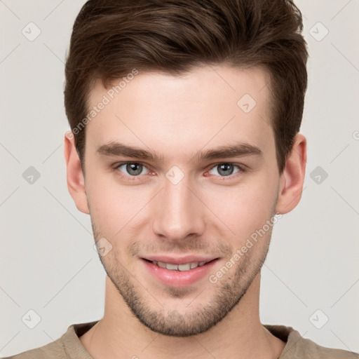 Joyful white young-adult male with short  brown hair and grey eyes