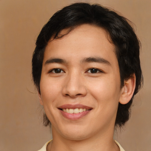 Joyful asian young-adult male with medium  brown hair and brown eyes