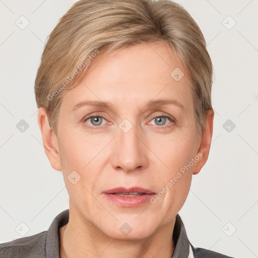 Joyful white adult female with short  brown hair and grey eyes