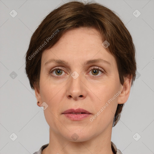 Joyful white adult female with short  brown hair and grey eyes