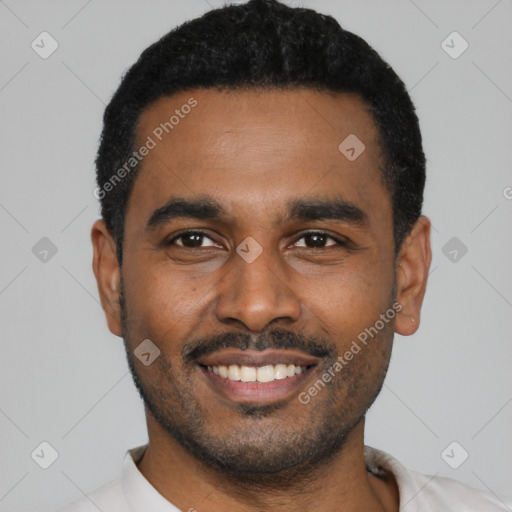 Joyful latino young-adult male with short  black hair and brown eyes