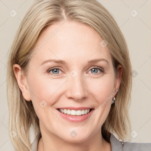 Joyful white adult female with medium  brown hair and blue eyes