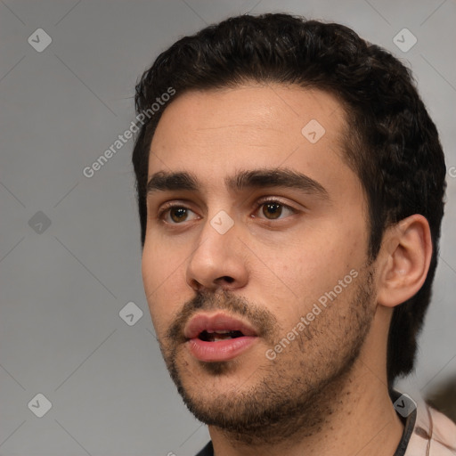 Neutral white young-adult male with short  black hair and brown eyes