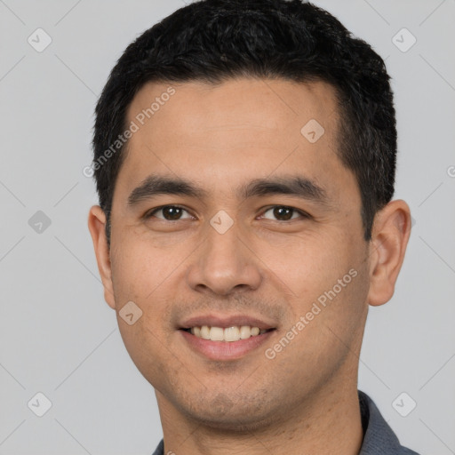 Joyful white young-adult male with short  black hair and brown eyes