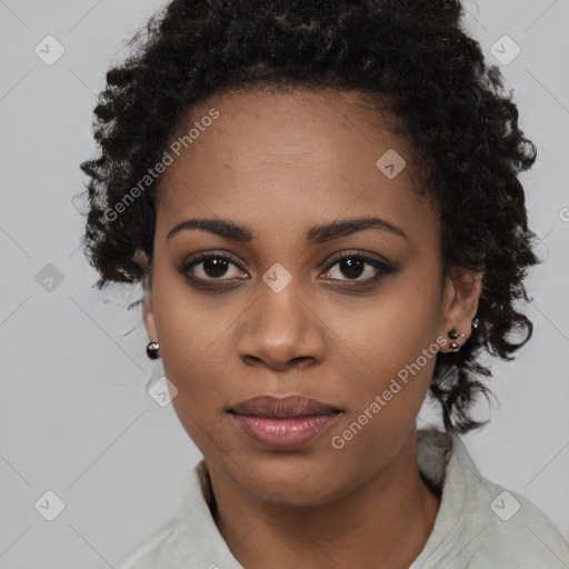 Joyful black young-adult female with long  black hair and brown eyes