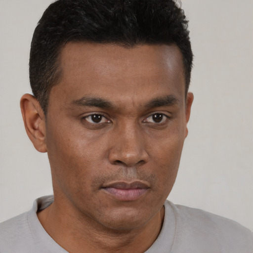 Neutral black young-adult male with short  brown hair and brown eyes
