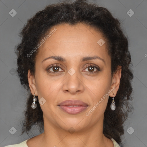 Joyful latino adult female with medium  brown hair and brown eyes