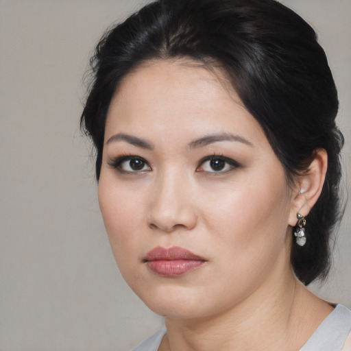 Neutral asian young-adult female with medium  brown hair and brown eyes